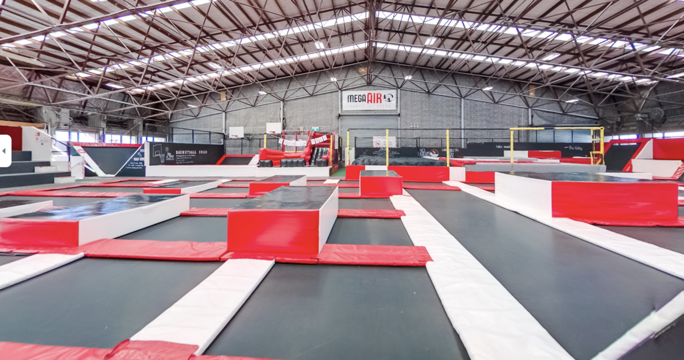 Indoor trampoline park with kids bouncing at MegaAir Christchurch